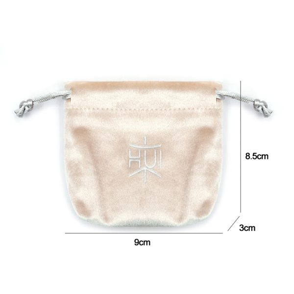 Luxury velvet drawstring jewelry pouch in customizable color, perfect for packaging rings, necklaces, earrings, and cosmetic gifts, with embroidered logo option.
