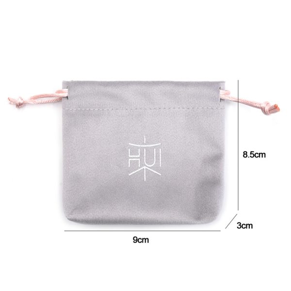 Luxury velvet drawstring jewelry pouch in customizable color, perfect for packaging rings, necklaces, earrings, and cosmetic gifts, with embroidered logo option.